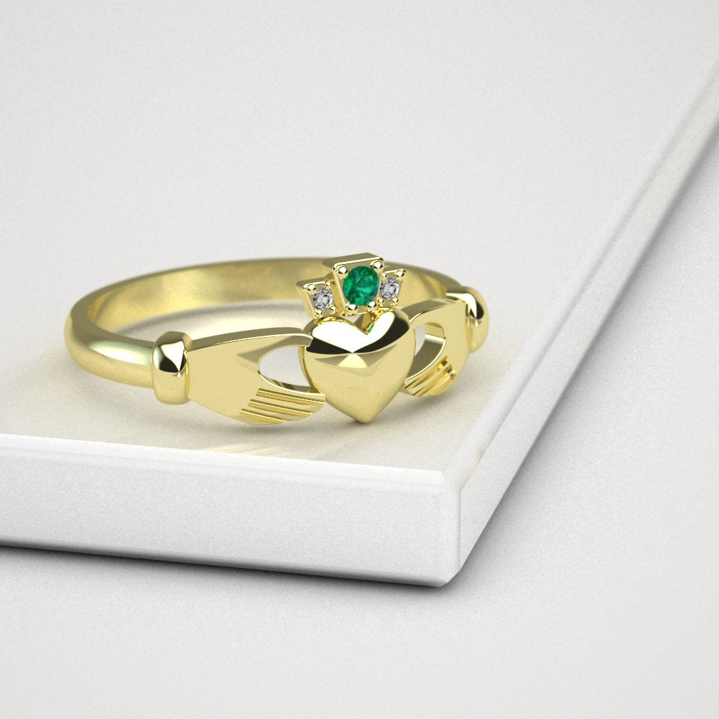 Claddagh ring. The Emerald Lover's Kiss Claddagh Ring for ladies.