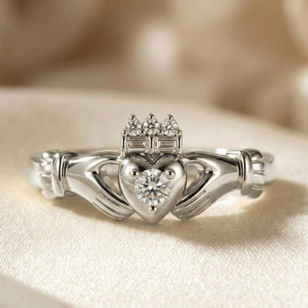 Gold claddagh ring with a diamond on a beige fabric background