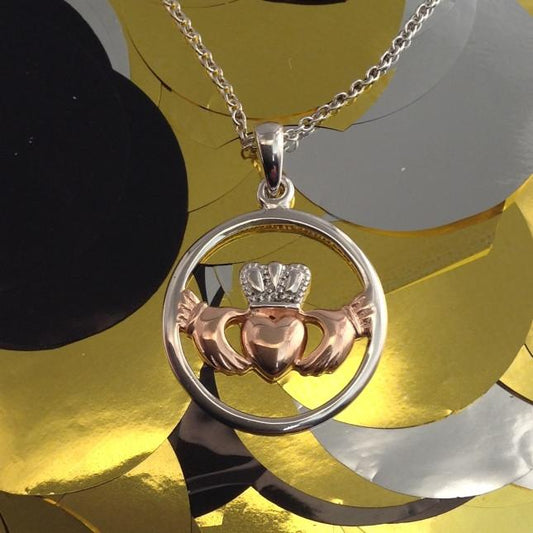 Irish Silver Claddagh Necklace With Rose Gold Plated Claddagh Detail.