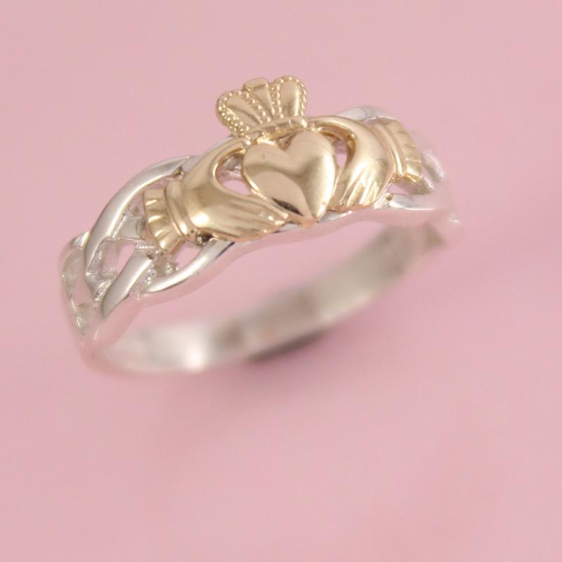 claddagh ring. Gold Irish ring with silver band.
