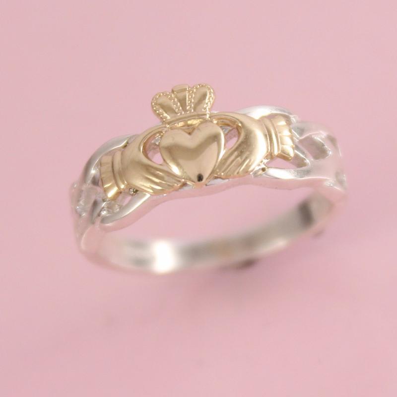 claddagh ring. solid gold claddagh top with silver band.